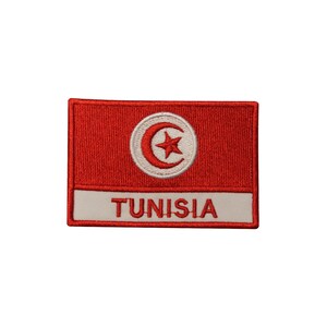 May include: Red embroidered patch with the Tunisian flag, a white circle with a red crescent moon and a white star, and the word "TUNISIA" in white.