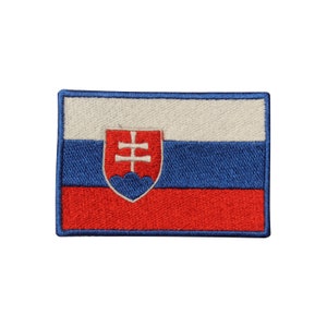 May include: Embroidered patch of the Slovakian flag. The flag is white, blue, and red with the Slovakian coat of arms in the center.