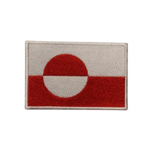 May include: A white and red embroidered patch featuring the flag of Greenland. The flag has a large red circle with a white crescent shape on a white background. The bottom half of the flag is red.