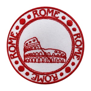 May include: Red embroidered patch with a white background featuring a stylized image of the Colosseum and the word "ROME" repeated four times around the border.