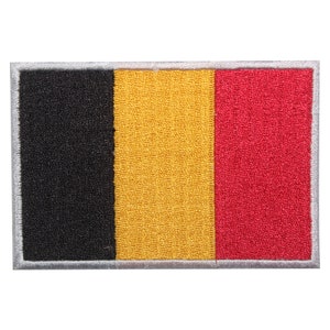 May include: A black, yellow, and red embroidered patch with a white border. The patch features the colors of the Belgian flag.