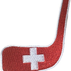 May include: Red and white embroidered hockey stick patch with a Swiss flag design.