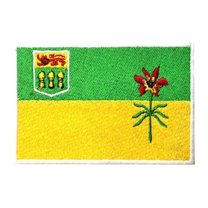 May include: An embroidered patch of the flag of Saskatchewan, Canada. The flag is green and yellow with a red and yellow prairie lily in the center and the provincial coat of arms in the upper left corner.