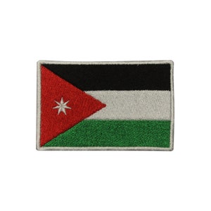 May include: An embroidered patch featuring the flag of Jordan. The flag is red, white, black, and green with a seven-pointed star in the red triangle.