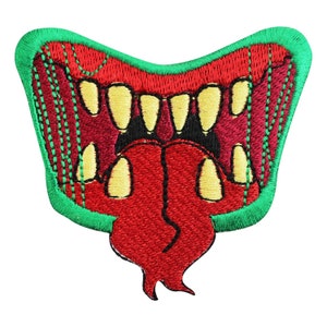 May include: An embroidered patch depicting a monster's open mouth with sharp teeth and a long tongue, in red and green.