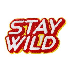 May include: Red and yellow embroidered patch with the text "Stay Wild" in white.