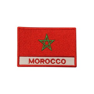 May include: A red embroidered patch with a green five-pointed star and the word "MOROCCO" in white.