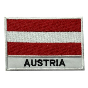 May include: Embroidered patch featuring the Austrian flag with red and white stripes and the word "AUSTRIA" in black lettering on a white background.