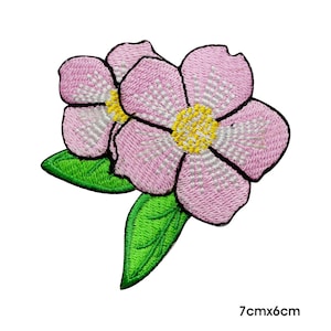 May include: Pink embroidered flower patch with green leaves. The patch measures 7cm by 6cm.