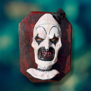 Art the clown, hand made bust  sculpture on bloody wooden frame. Great gift for movie buff or spooky Home Decor for spooky Christmas.