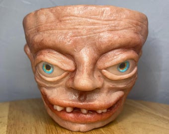 Terracotta Planter Artwork, called Creepy McGee Handmade Cyclops Sculpture on planter