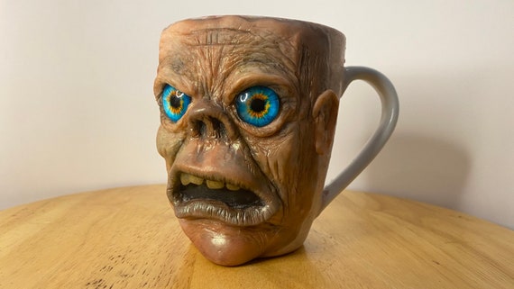 Uglymug - each sculpture is a hand made one of a kind coffee Mug. His name is “Rob”