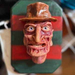 Handmade Freddy, Horror hanging polymer clay sculpture on wooden frame. Great movie buff gift, spooky Home Decor, movie related Fan Gift.