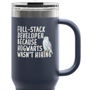 May include: Dark blue travel mug with a handle and a straw. The mug has the text "FULL-STACK DEVELOPER BECAUSE HOGWARTS WASN'T HIRING" and a snowy owl illustration.