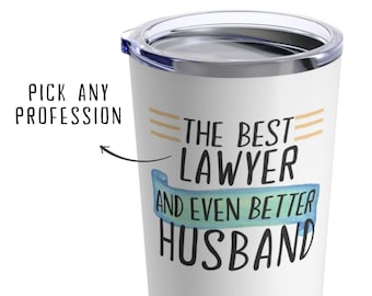 May include: White stainless steel tumbler with a black and blue design that says "The Best Lawyer and Even Better Husband".