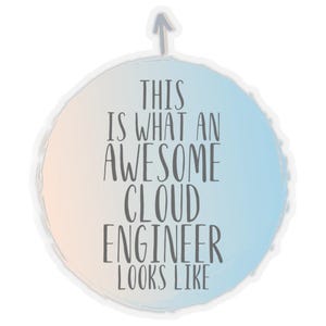 May include: A round sticker with a gradient background of light pink and blue, featuring the text "THIS IS WHAT AN AWESOME CLOUD ENGINEER LOOKS LIKE" in gray. An upward-pointing arrow is at the top.