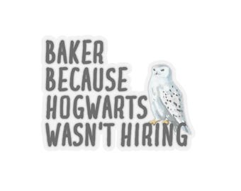 May include: A white sticker with a gray text overlay that reads "Baker because Hogwarts wasn't hiring". A white snowy owl is to the right of the text.