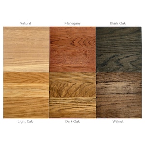 May include: A grid of six wood grain samples labeled Natural, Mahogany, Black Oak, Light Oak, Dark Oak, and Walnut. Each square displays a distinct wood finish with visible grain patterns, ranging from light tan to deep brown and black tones.