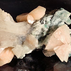 Heulandite and bright peach stilbite crystals on matrix