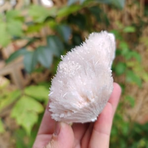 Pink natrolite on matrix with calcite crystals