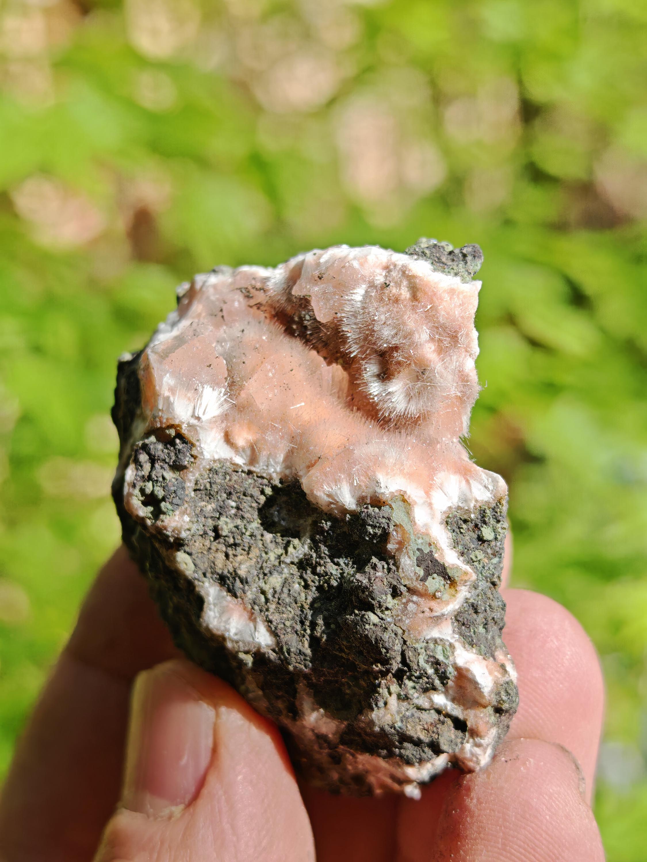 Orange mesolites on matrix, A+