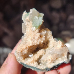 Green apophyllite geode with stylute on orange heulandite