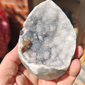 Calcite on bright blue celestine geode