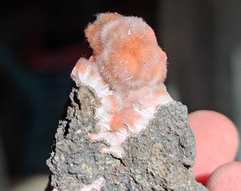 Orange mesolites on matrix, A+