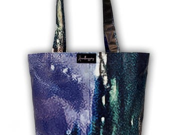Shopping tote bags made entirely from discarded billboards from the Van Gogh immersive exhibit, Denver