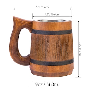 May include: A wooden beer stein with a stainless steel liner. The stein is brown with black bands around the top and bottom. It measures 6.3 inches tall, 4.2 inches wide, and 5.6 inches in diameter. The stein holds 19 ounces or 560 milliliters.