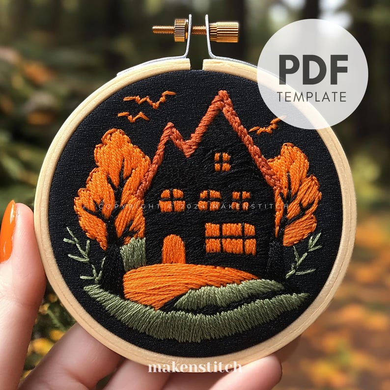 May include: A black and orange embroidery pattern of a house with a black roof and orange windows, surrounded by trees with orange leaves and green grass. The pattern is on a black fabric background and is in a wooden embroidery hoop. The text "PDF TEMPLATE" is in the upper right corner of the image.
