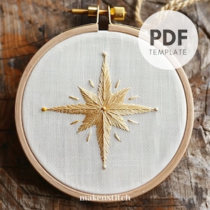 May include: A gold star embroidery pattern in a white embroidery hoop. The pattern is for a star with a burst of rays around it. The text "PDF TEMPLATE" is in the upper right corner of the image.