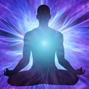 May include: Silhouette of a person in a seated meditation pose, radiating a bright blue light from the chest. The background features a vibrant display of purple and blue energy lines, creating a sense of spiritual aura.