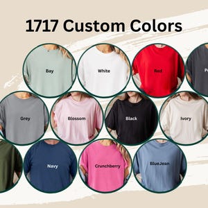 May include: An image showcasing a variety of t-shirt colors, including Bay, White, Red, Pepper, Grey, Blossom, Black, Ivory, Moss, Navy, Crunchberry, and BlueJean. The text "1717 Custom Colors" is displayed at the top of the image.