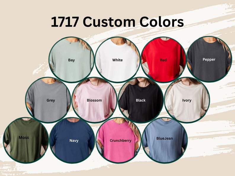 May include: An image showcasing a variety of t-shirt colors, including Bay, White, Red, Pepper, Grey, Blossom, Black, Ivory, Moss, Navy, Crunchberry, and BlueJean. The text "1717 Custom Colors" is displayed at the top of the image.