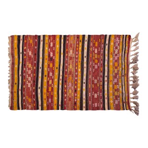 May include: A rectangular rug with a striped pattern in red, yellow, black, and white. The rug has fringed edges. The design features vertical stripes with geometric patterns and varying widths, suitable for home decor, measuring approximately 150cm x 90cm.