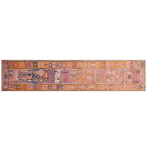 May include: A long, rectangular rug with a patchwork design. The rug features geometric patterns in orange, pink, blue, and purple. The rug's border is a darker orange, and the overall style is vintage, suitable for a hallway.