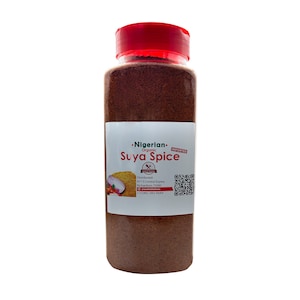 May include: A clear plastic jar with a red lid filled with brown suya spice. The label reads "Nigerian Organic Suya Spice" and includes contact information and a QR code.