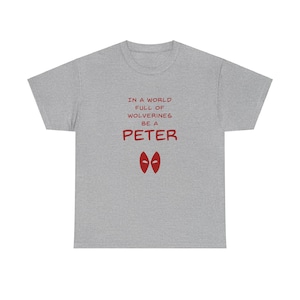 May include: Gray t-shirt with red text that reads "In a world full of Wolverines, be a Peter" with two red eyes below the text.