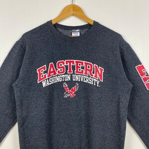 May include: Grey sweatshirt with the text "Eastern Washington University" in red and white lettering. A red and white eagle logo is below the text.