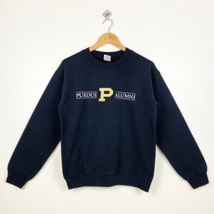 May include: Black sweatshirt with a gold embroidered "P" and the text "Purdue Alumni" on the front.