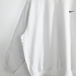 May include: A set of three ceramic mugs with a speckled, matte finish. The mugs are in shades of cream, light gray, and dark gray. Each mug has a simple, minimalist design, perfect for coffee or tea.