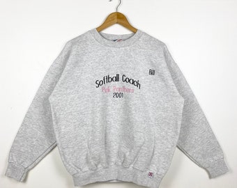 May include: Gray sweatshirt with the text "Softball Coach Pink Panthers 2001" and "Bill" embroidered on the front.