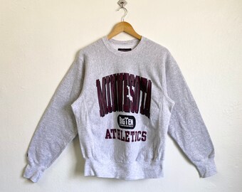 May include: Gray sweatshirt with a maroon "MINNESOTA" graphic and "BIG TEN CONFERENCE" and "ATHLETICS" text.