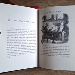 Pu&ograve; includere: Un'illustrazione in bianco e nero di due uomini seduti su sedie vicino a un camino. Il testo "Dr. Jekyll and Mr. Hyde" &egrave; in cima all'immagine. Il testo "DR. JEKYLL WAS QUITE AT EASE" &egrave; in cima alla pagina sinistra. Il testo "A FORTNIGHT later, by excellent good fortune, the doctor gave one of his pleasant dinners to some five or six old cronies, all intelligent, reputable men, and all judges of good wine; and Mr. Utterson so contrived that he remained behind after the others had departed. This was no new arrangement, but a thing that had befallen many scores of times. Where Utterson was liked, he was liked well. Hosts loved to detain the dry lawyer, when the light-hearted and the loose-womped had already their foot on the threshold; they liked to sit awhile in his unobtrusive company, practicing for solitude, sobering their minds in the man's rich silence after the expense and strain of gayety. To this rule, Dr. Jekyll was no exception, and as he now sat on the opposite side of the fire - a large, well-made, smooth-faced man of fifty, with something of a slyish cast, perhaps, but every mark of capacity and kindness - you could see by his looks that he cherished for Mr. Utterson a sincere and warm affection." &egrave; sulla pagina sinistra. Il testo "I have been wanting to speak to you, Jekyll," began the lawyer. "You know that will of yours?" &egrave; sulla pagina destra.