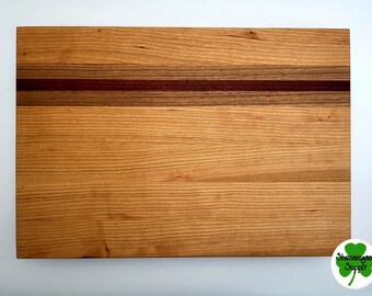 Cherry, walnut, and padauk edge grain hardwood cutting board / charcuterie cheese board / serving tray with non-marring feet.