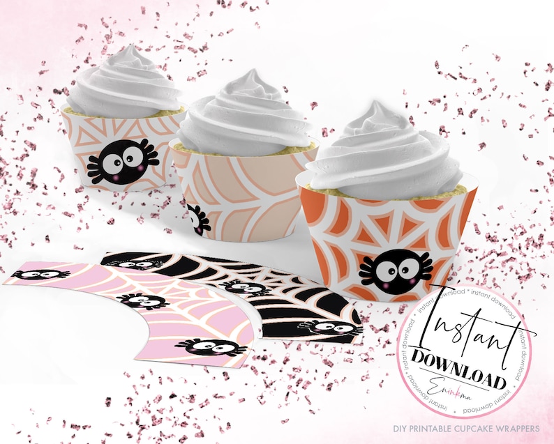 May include: Printable cupcake wrappers with a spider web design in pink, orange, and black. The wrappers feature a cute cartoon spider with googly eyes. The text "Instant Download" is visible in the image.