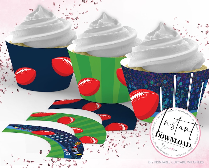 May include: Cupcakes with white frosting in decorative football-themed wrappers. The wrappers feature red footballs on navy, green, and a speckled blue background. Additional wrappers are displayed below, with a stadium design.