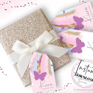 May include: A gold glitter gift box tied with a white ribbon, accompanied by pink and purple butterfly-themed favor tags. The tags feature the text "Kura butterfly treats" and "Instant Download".