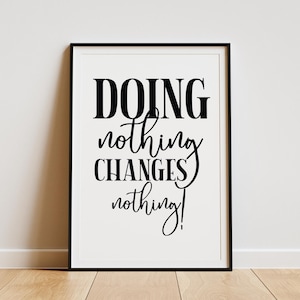 May include: Black and white framed print with the text "DOING nothing CHANGES nothing!" on a white background.